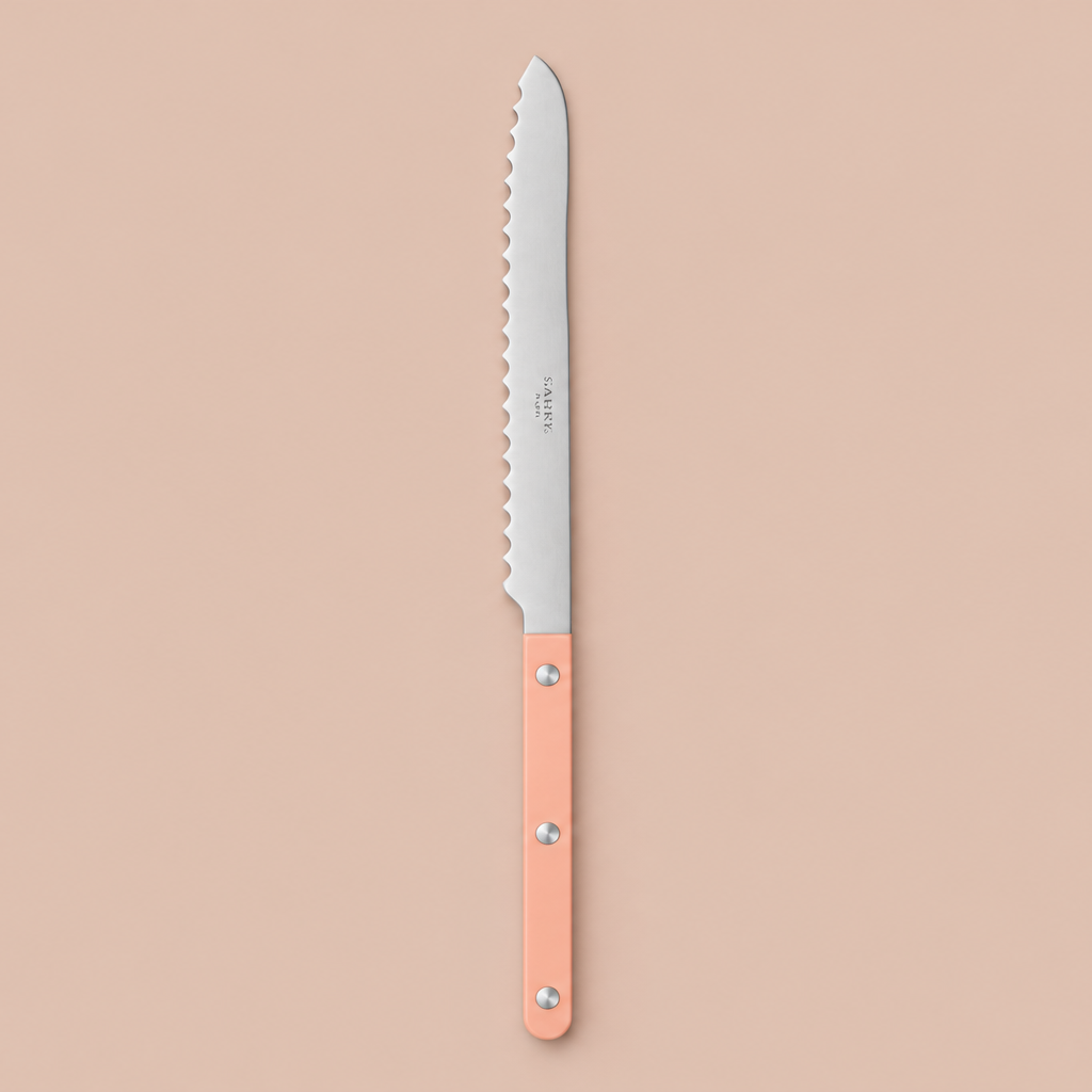 Nude Pink Sabre Bread Knife on blush-beige background
