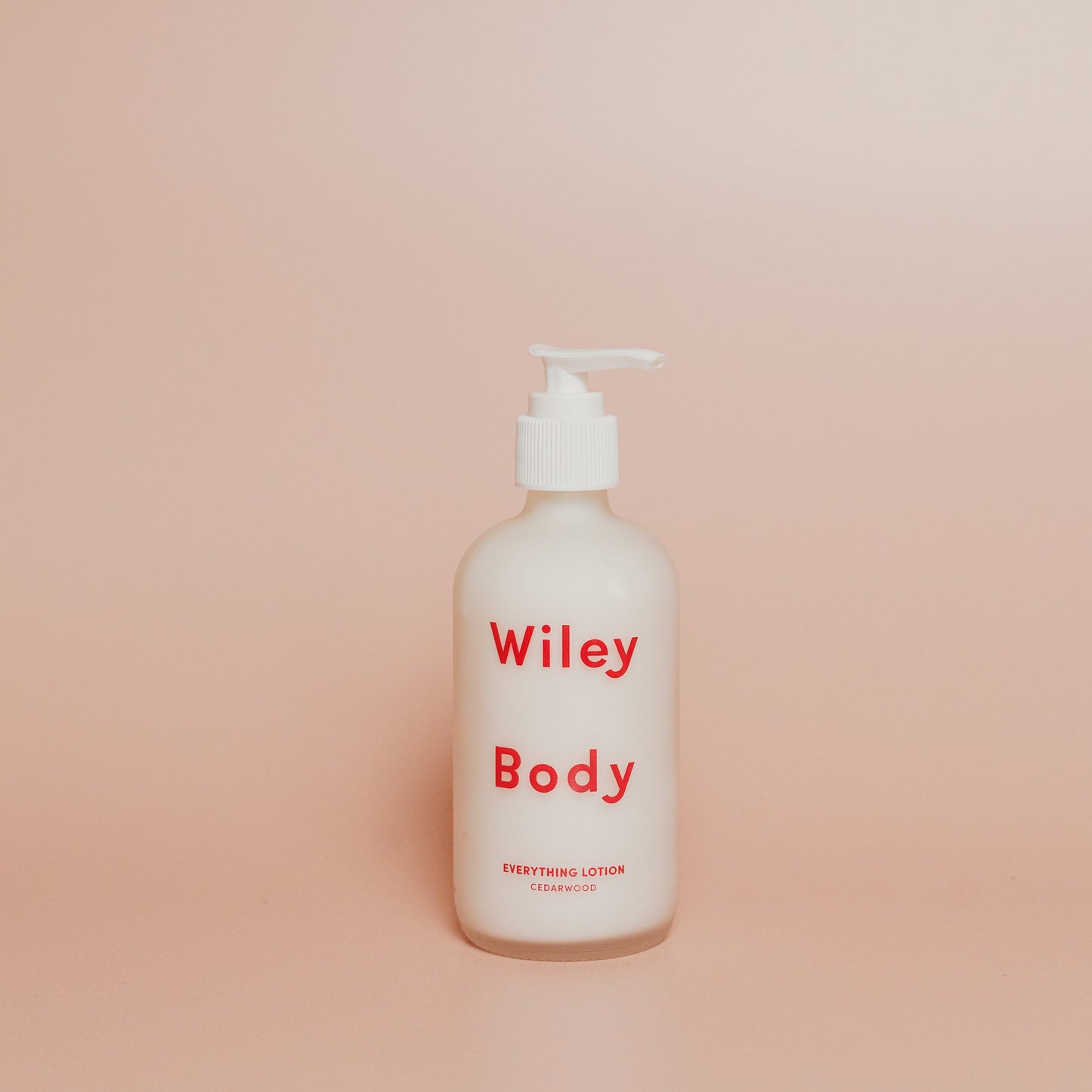 Wiley Body lotion bottle on a beige background