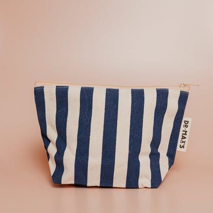 Navy and beige striped pouch on a beige background