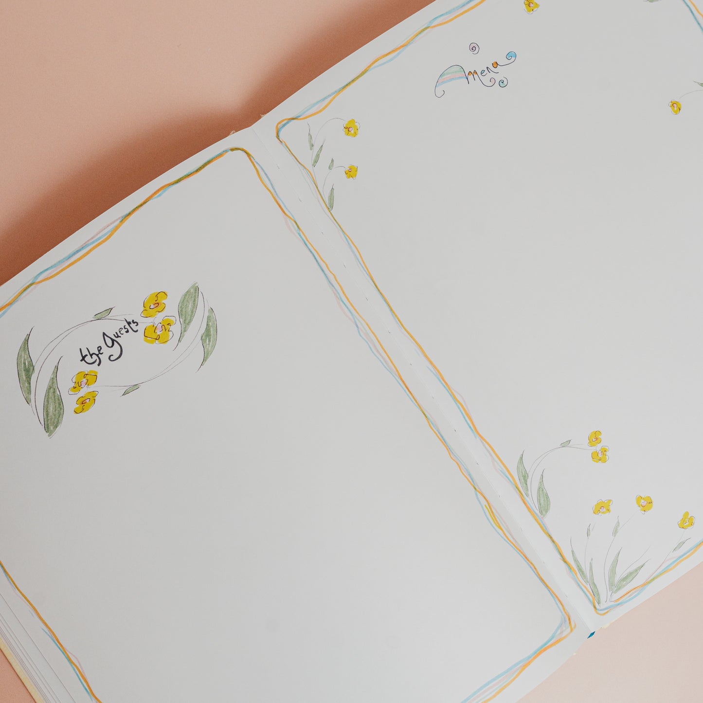 Floral embroidered tablecloth with yellow flowers and green leaves on a beige background