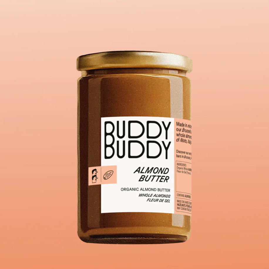 Jar of Buddy Buddy Almond Butter on a peach background