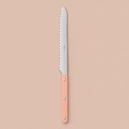 Nude Pink Sabre Bread Knife on blush-beige background