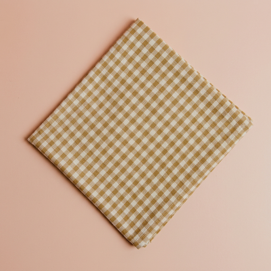 Toro Beige Check Napkins on the standard blush-peach background